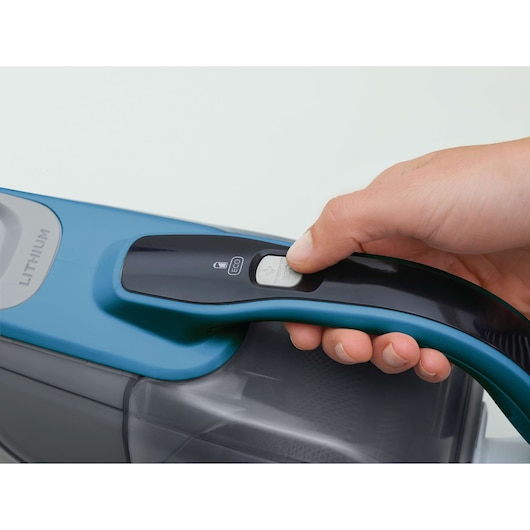 BLACK+DECKER DVJ320J handheld vacuum cleaner close-up showing control button and part of handle.